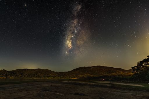 A picturesque landscape under the breathtaking starry night sky in Hong Kong