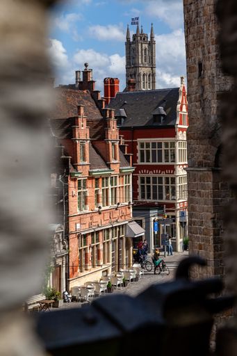 A vertical shot of the flemish historical buildings in Ghent, Belgium under the bright sunlight