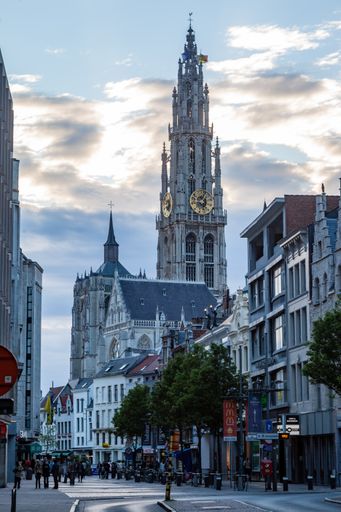A beautiful view of the clock tower of the Church of our lady of Antwerp against blue cloudy sky, Belgium