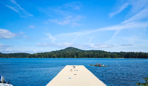 a beautiful wooden jetty over Victoria City Lake.
