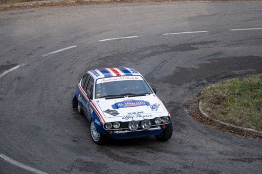 A closeup of an Alfa Romeo GTV in 9 Lloret de Mar asphalt rally