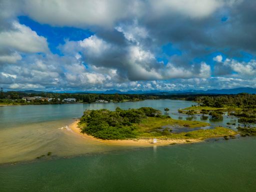 An aerial view of the beautiful landscape with ocean on a cloudy day in Urunga, NSW, Australia