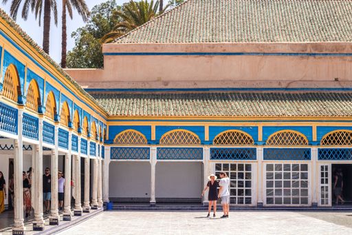 A horizontal view of ornamented arches in Bahia Palace on a sunny day in  Marrakesh, Morocco
