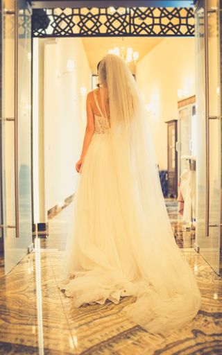 A back view of a bride