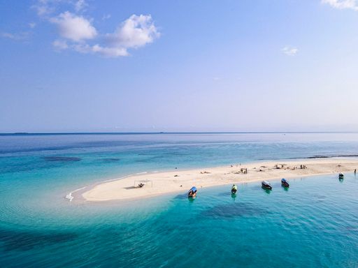 a photo from drone on beach in blue ocean