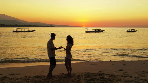 A shot of a beautiful Russian couple resting in Gili Meno, Lombok, Indonesia, Asia during a sunset