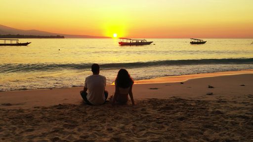 An image of romantic Russian lovers on the sand on vacation in Gili Meno, Lombok, Indonesia, Asia