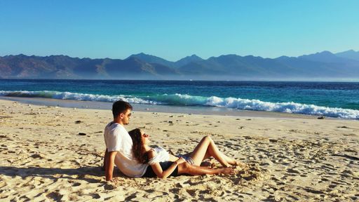 A shot of a beautiful couple sitting in Gili Meno, Lombok, Indonesia, Asia