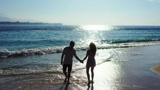 A romantic couple enjoying their time together on the beach on Gili Islands, Indonesia