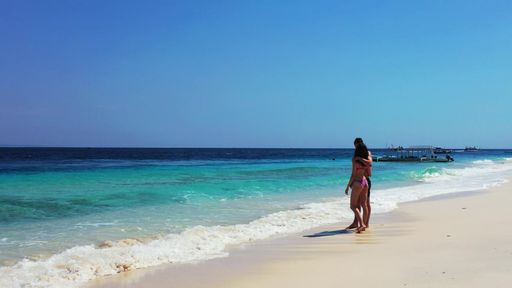 A romantic couple enjoying their time together on the beach on Gili Islands, Indonesia