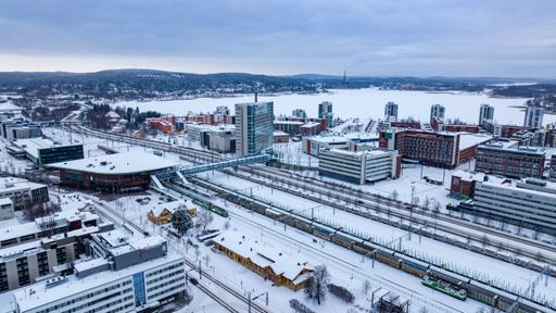 Aerial view away from the Lutakko area and the railway station in Jyvaskyla, winter evening in Finland