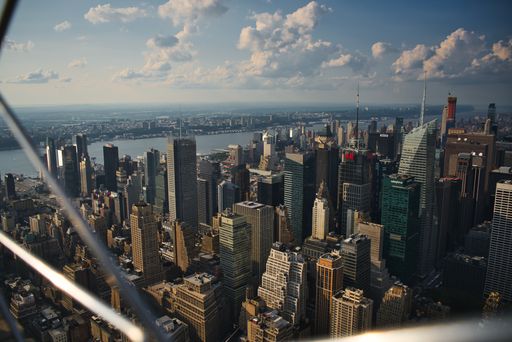 An aerial shot of the New York skyline view with tall buildings taken from the Empire State Building