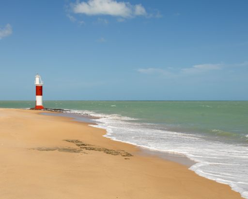 A lifeguard tower on the beach on a sunny day