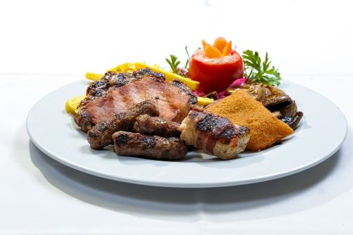 A different types of meat dishes on a white plate with white background