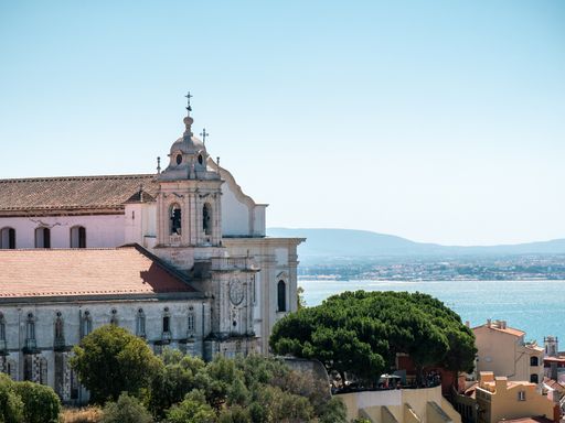A distant view of the Church of Our Lady of Grace on a sunny day in Lisbon, Portugal