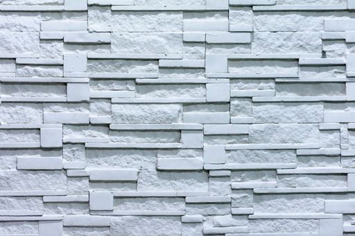 A closeup of a stone wall texture made from stiff stone