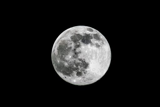 Full moon against black night sky