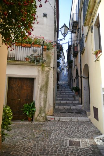 A Vertical shot of a narrow street in the historic center of Rivello, in the Basilicata region, Italy
