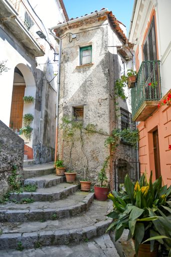 A Vertical shot of a narrow street in the historic center of Rivello, in the Basilicata region, Italy