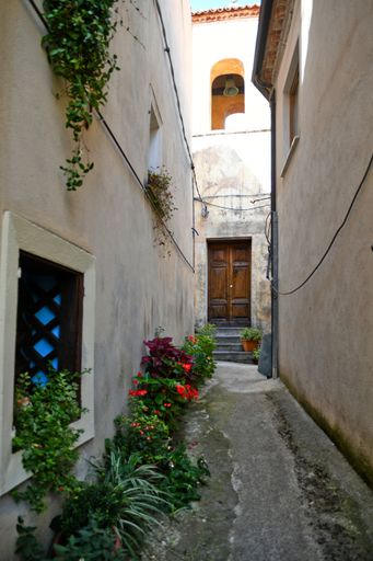 A Vertical shot of a narrow street  in the historic center of Rivello, in the Basilicata region, Italy
