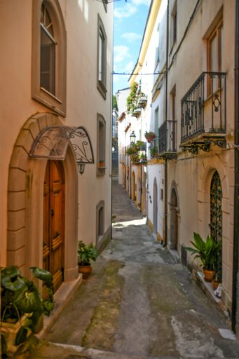 A Vertical shot of a narrow street in the historic center of Rivello, in the Basilicata region, Italy