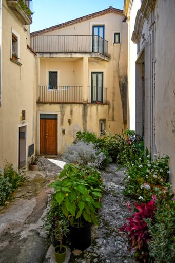 A Vertical shot of a narrow street  in the historic center of Rivello, in the Basilicata region, Italy