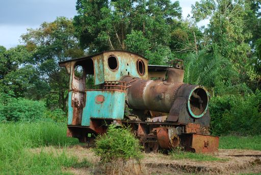 A landscape shot of an old rusty abandoned train front