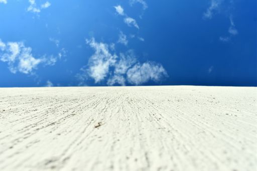 a shot of white concrete wall agaisnt blue sky