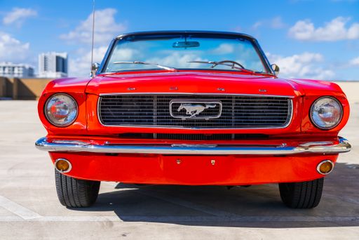 A front view of red 1966 convertible Ford Mustang with convertible rooftop, Broward, USA