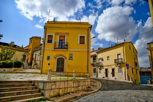 A shot of a narrow street in an old town in the Basilicata region, Italy.