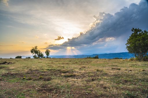 A mesmerizing shot of a beautiful  landscape under the cloudy sky