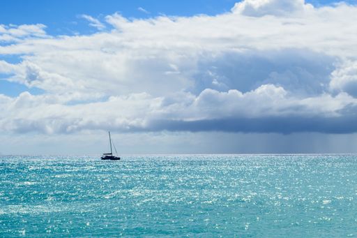 A cruise ship on the Maho Beach, Sint Maarten, Dutch Caribbean on a cloudy day