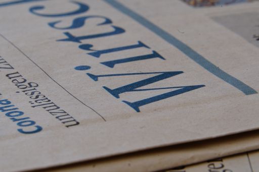 A closeup shot of an economy section of a newspaper