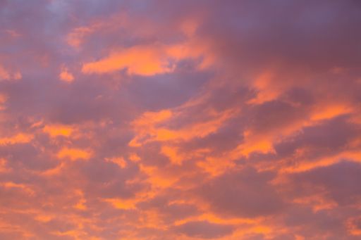 A beautiful low angle shot of the sky at the sunset with colorful clouds