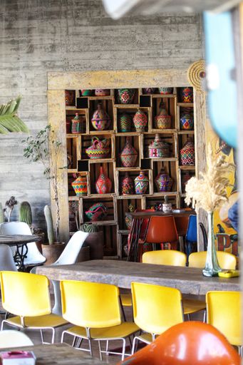 vertical photo of cafe with pots and jugs