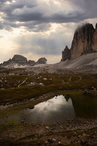a vertical shot of Trail close to Mountain range Drei Zinnen.