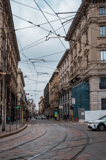 A vertical shot of an empty street near Duommo Di Milano, Italy