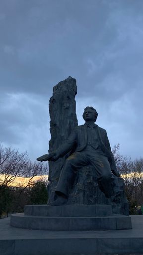 The vertical shot of an Armenian poet Hovhaness Shiraz's statue