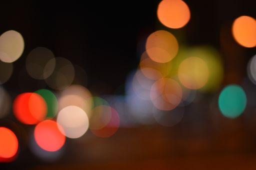 A closeup shot of colorful bokeh lights at night time