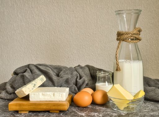 Different dairy products on a rustic background