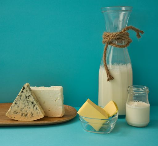 A closeup shot of different dairy products on a blue background
