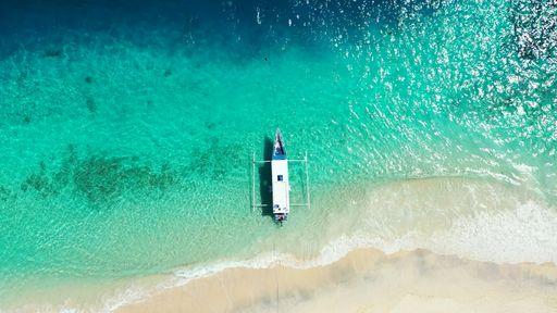 a shot of boat around the beach on the Maldives