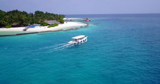 a shot of boat around the beach on the Maldives