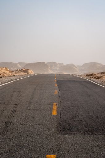 An empty endless road through the desert