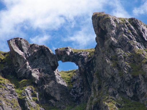 A low angle shot of the beautiful hills in Refuge de Plaisance in France under a cloudy blue sky