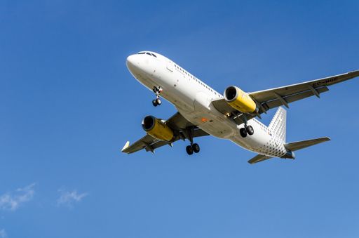 The view of the Vueling Airbus A320 plane landing at Barcelona El Prat airport.