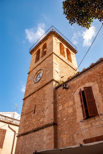 A low angle shot of a San Joan church tower in Son Servera, Majorca