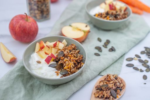 A healthy Easter granola with carrots in a white bowl