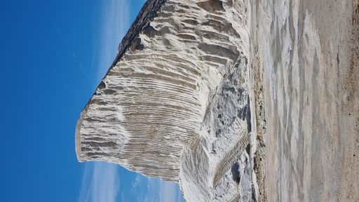 A beautiful shot of mountain covered by ice in Portugal with blue sky in the background