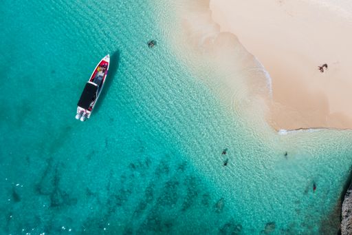 A top view of a boat on the sandy beach of Baie Longue, Saint Martin